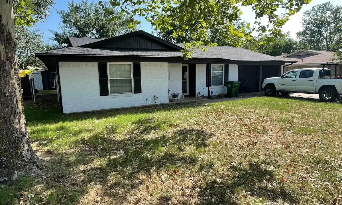 Professional roofing crew working on a residential roof in Moosic